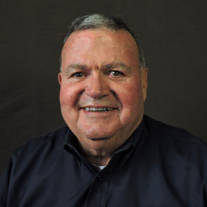 Mike Cantieri smiling in blue polo shirt